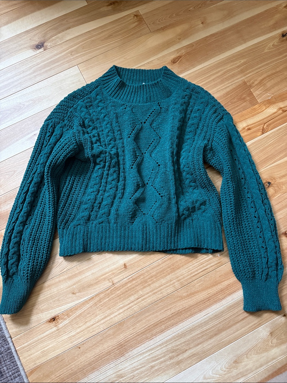 Cropped cable knit sweater